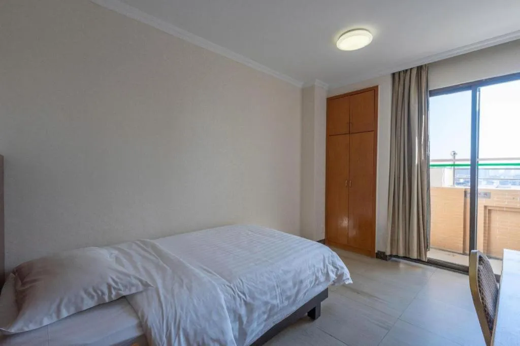 Bed in Nanfang Dasha Hotel