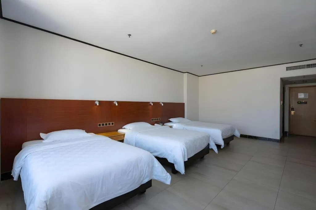 Bed in Nanfang Dasha Hotel