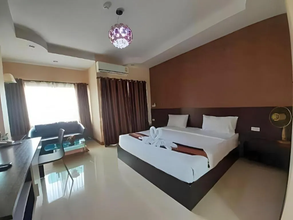 Bed in Le Parc Wangnang Hotel