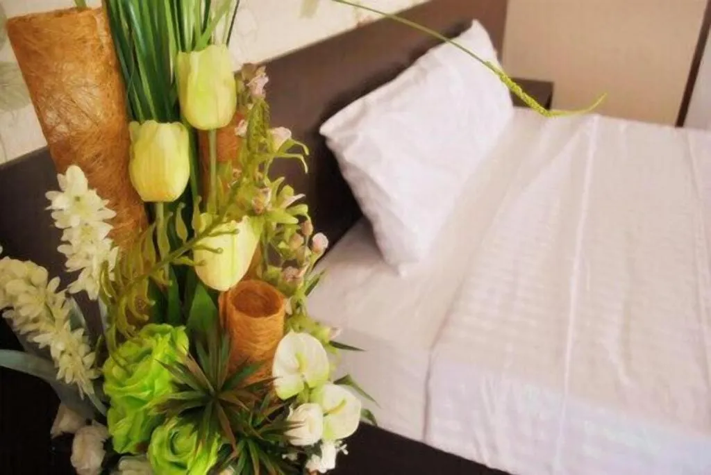 Bed in Le Parc Wangnang Hotel