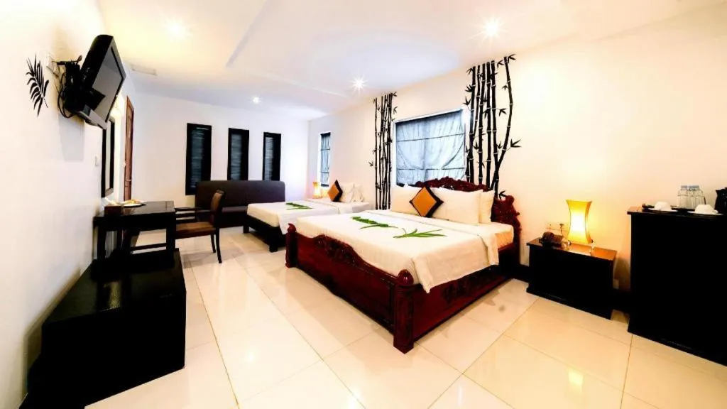 Bed in La Residence Blanc D' Angkor