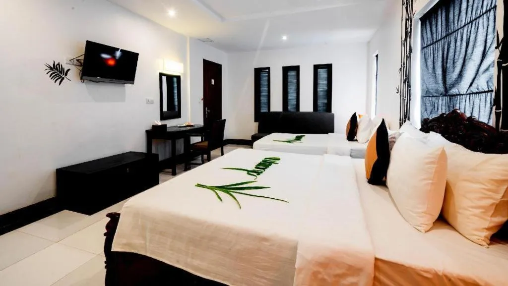 Bed in La Residence Blanc D' Angkor