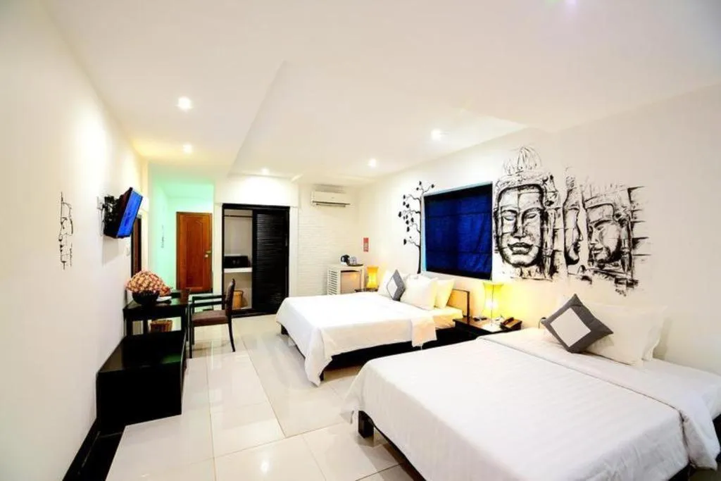 Bed in La Residence Blanc D' Angkor