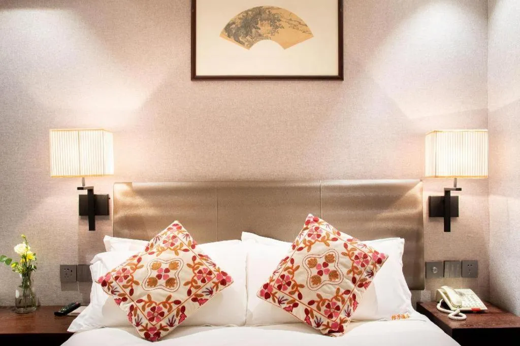 Bed in Yiwu Orange Boutique Hotel