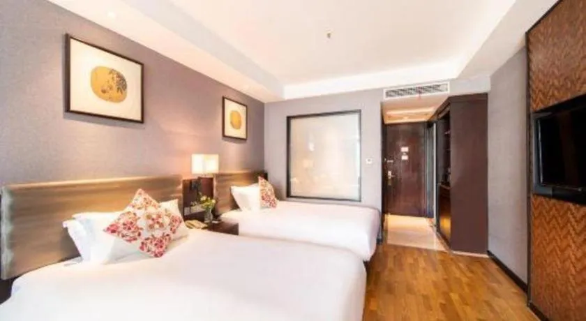 Bed in Yiwu Orange Boutique Hotel