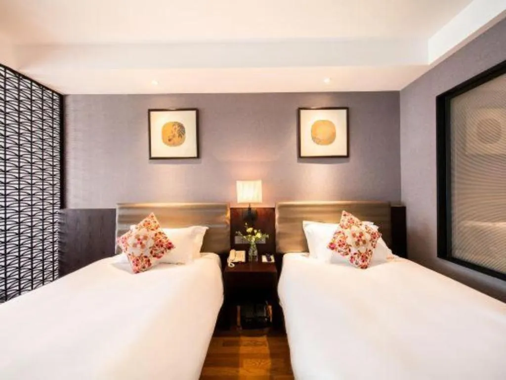 Bed in Yiwu Orange Boutique Hotel