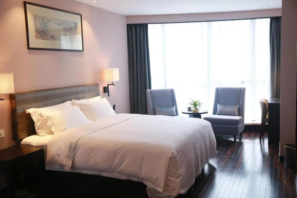 Bed in Yiwu Orange Boutique Hotel