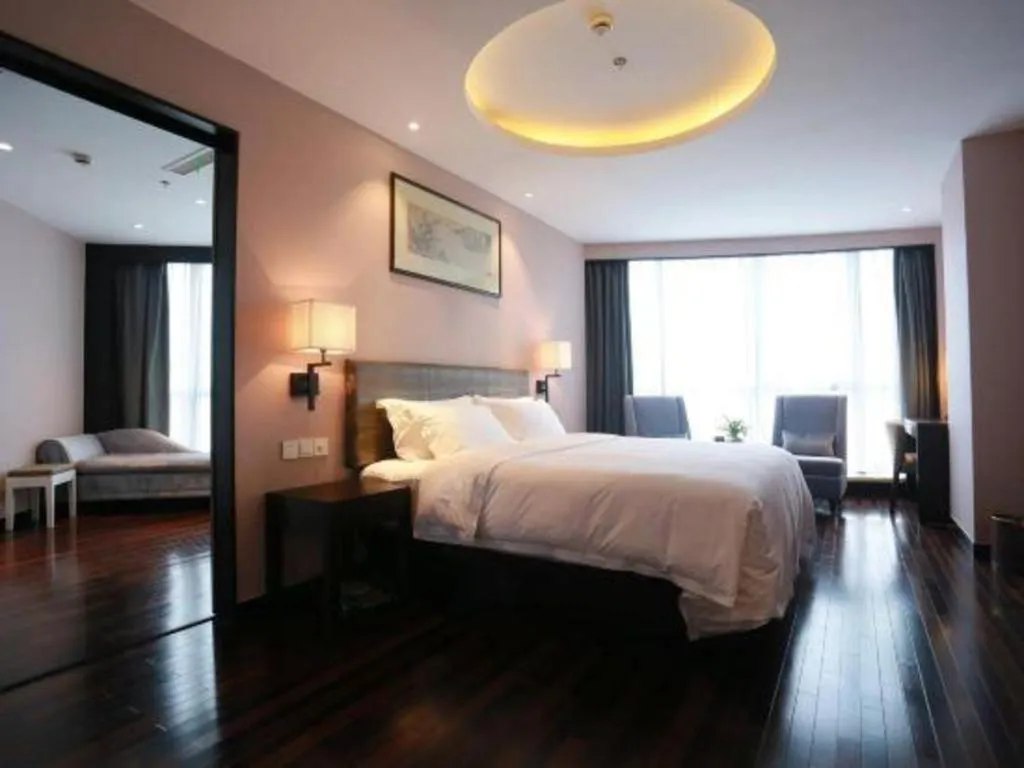 Bed in Yiwu Orange Boutique Hotel