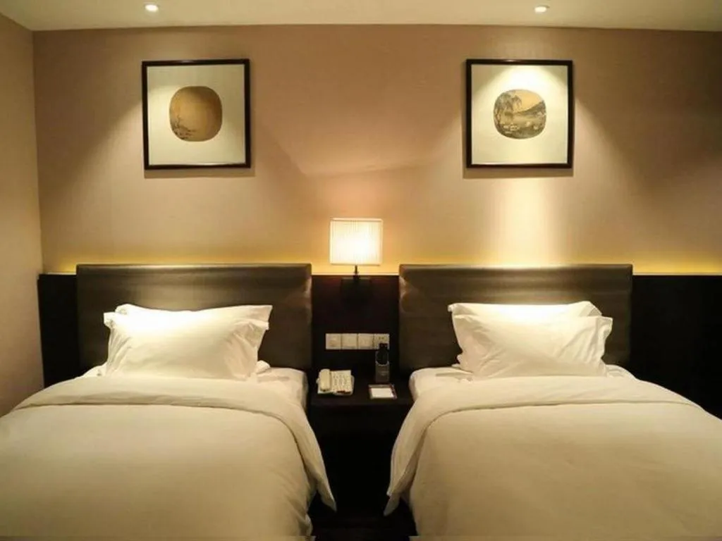 Bed in Yiwu Orange Boutique Hotel