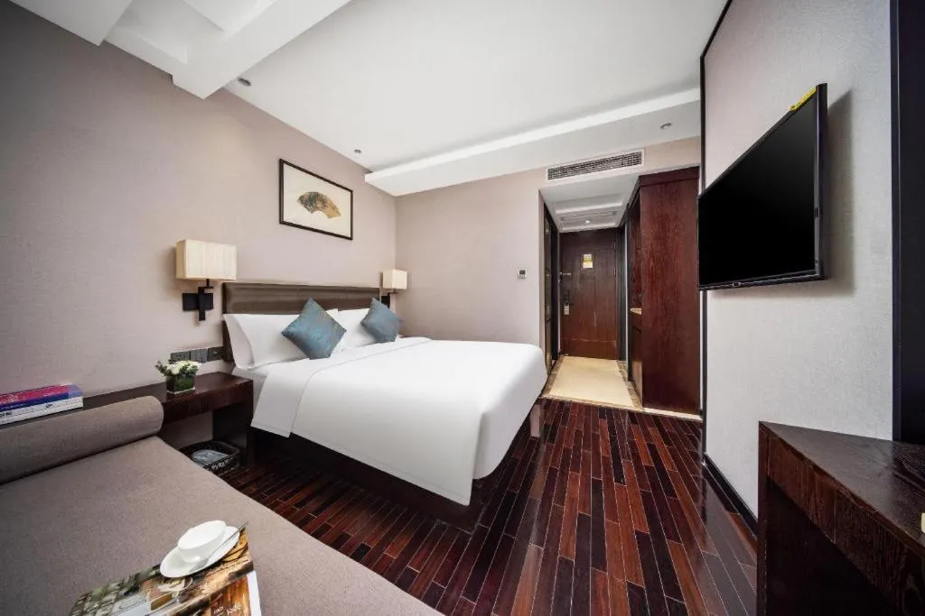 Bed in Yiwu Orange Boutique Hotel