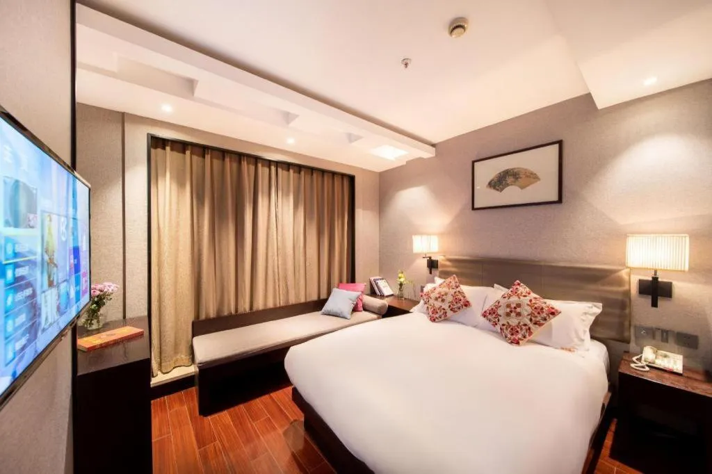 Bed in Yiwu Orange Boutique Hotel