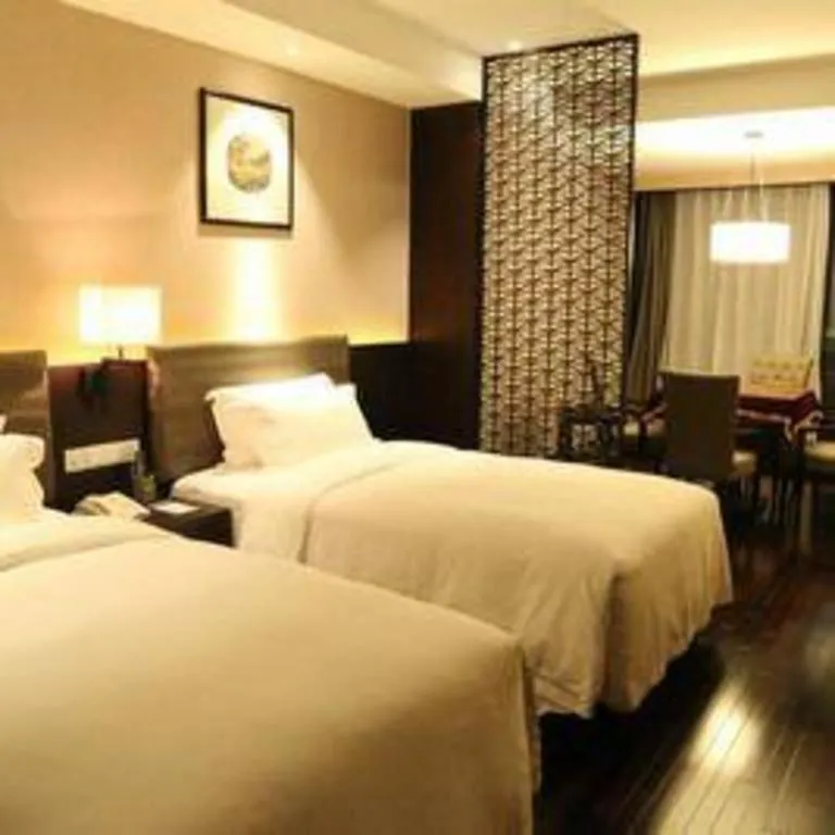 Bed in Yiwu Orange Boutique Hotel