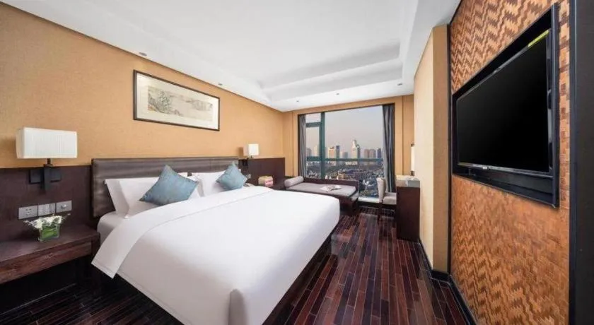 Bed in Yiwu Orange Boutique Hotel