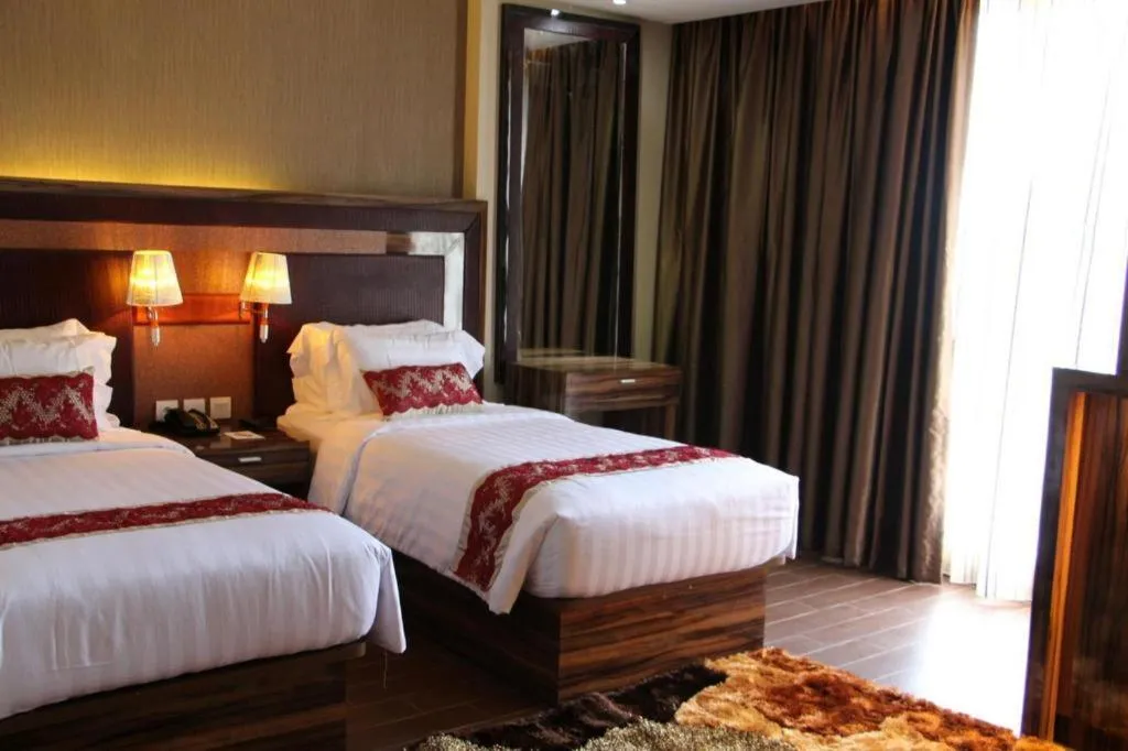 Bed in The Belagri Hotel and Convention
