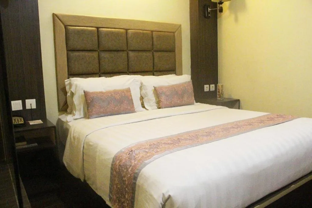 Bed in The Belagri Hotel and Convention