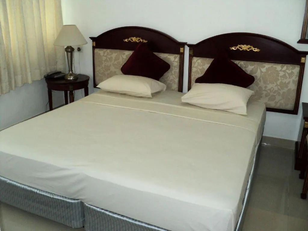 Bed in New Tristar Beach Hotel
