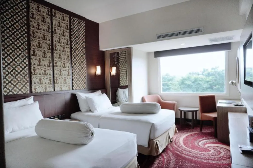 Bed in Indoluxe Hotel Jogjakarta