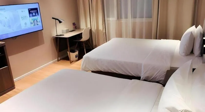 Bed in Hanting Hotel Shanghai People Square