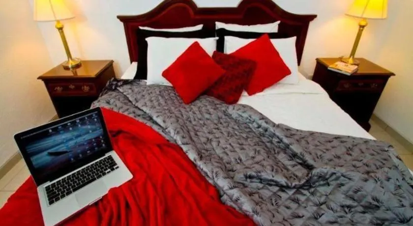 Bed in Terranova Suites