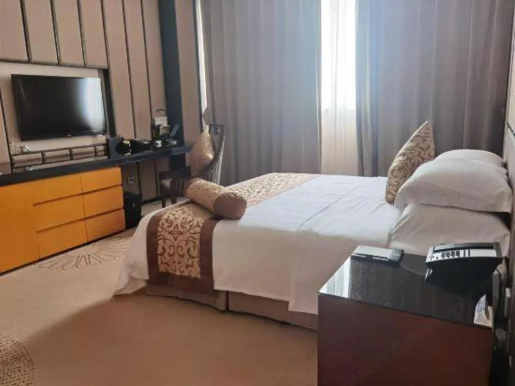 Bed in Jiuhua Jin Jiang International Hotel