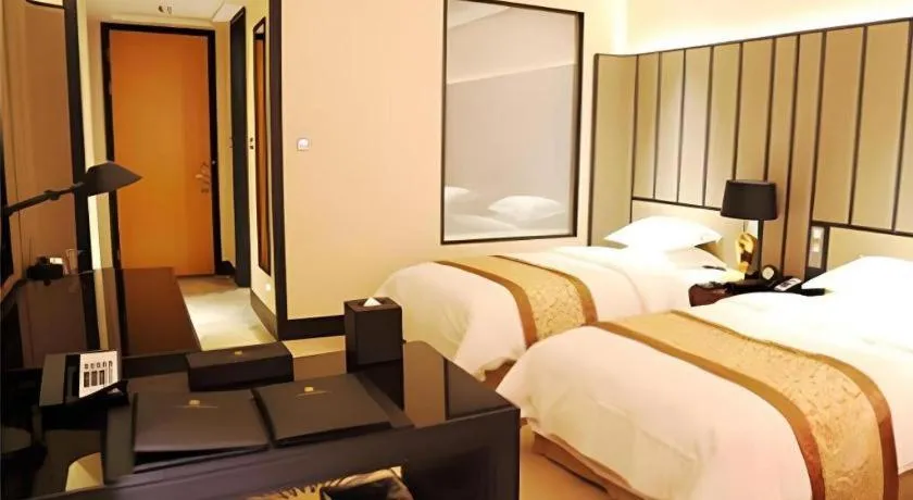 Bed in Jiuhua Jin Jiang International Hotel