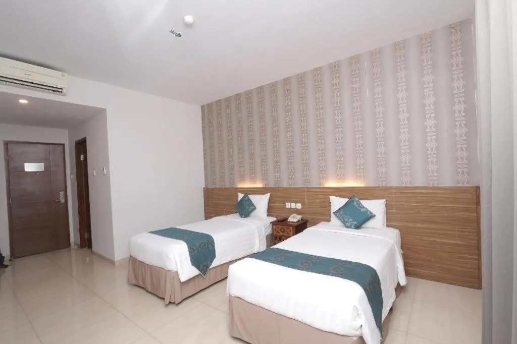 Bed in Grand Amira Hotel Solo, Azana Hotels Collection