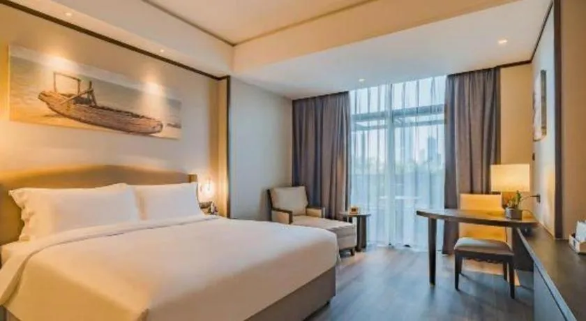 Bed in Zhuhai Starlight Hotel