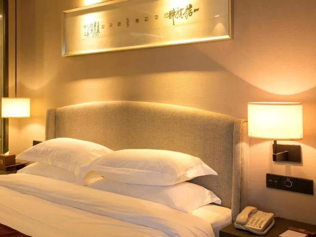 Bed in Zhuhai Starlight Hotel