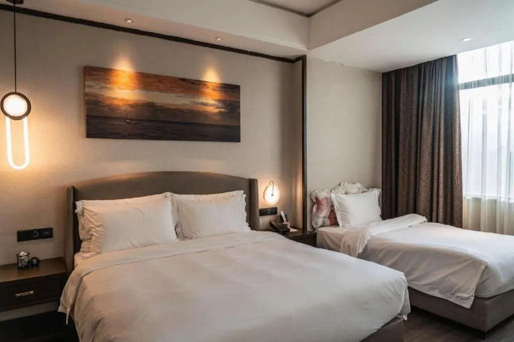 Bed in Zhuhai Starlight Hotel