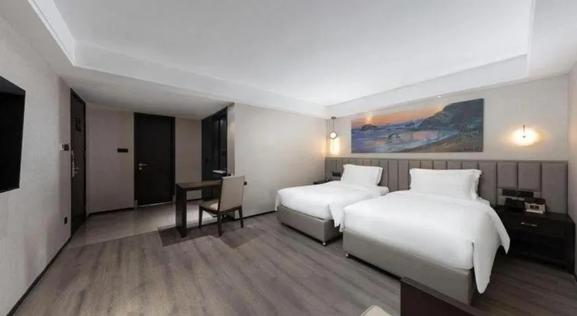 Bed in Zhuhai Starlight Hotel
