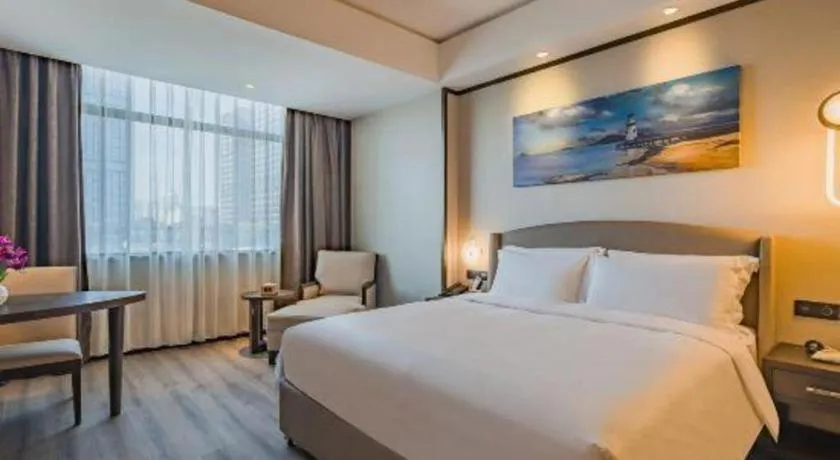 Bed in Zhuhai Starlight Hotel