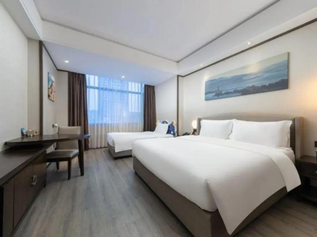 Bed in Zhuhai Starlight Hotel