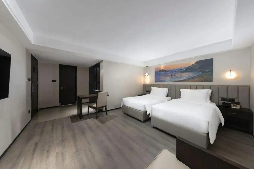 Bed in Zhuhai Starlight Hotel