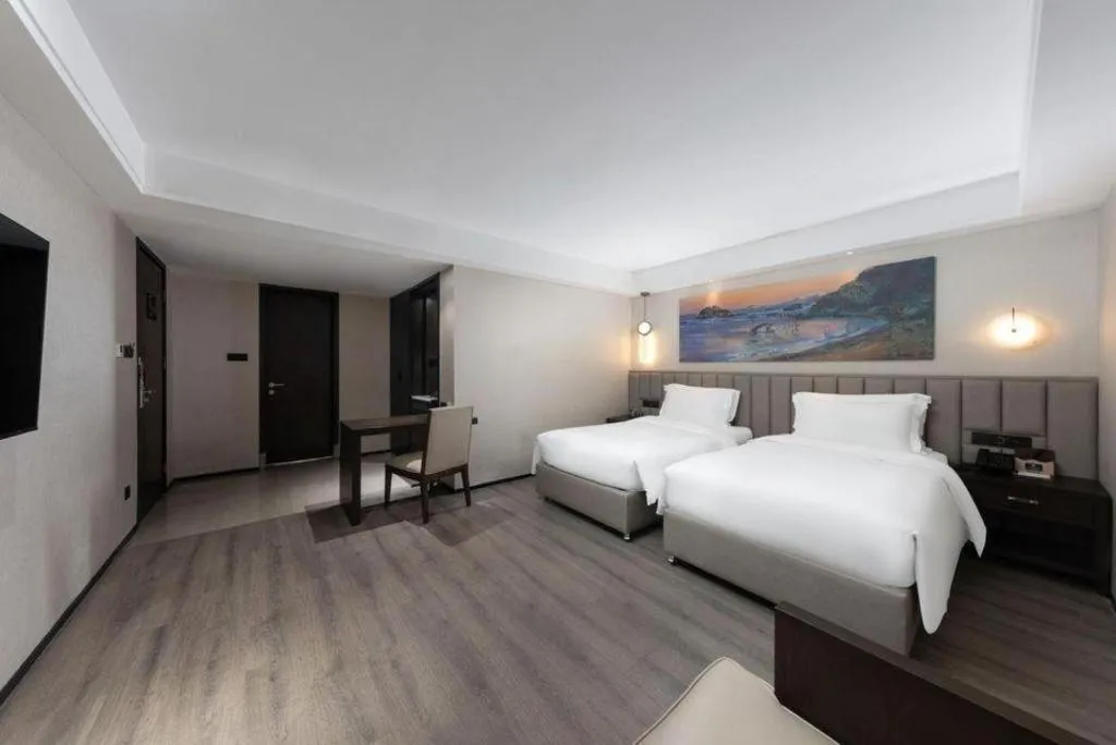 Bed in Zhuhai Starlight Hotel
