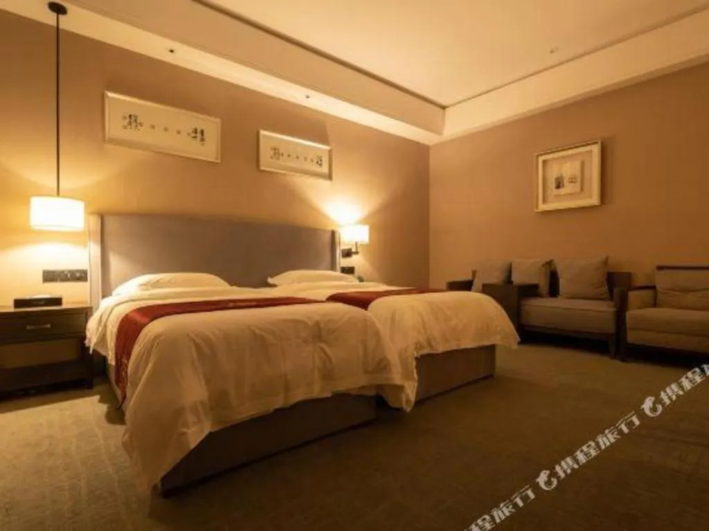 Bed in Zhuhai Starlight Hotel