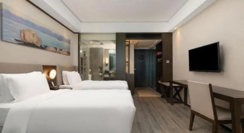 Bed in Zhuhai Starlight Hotel