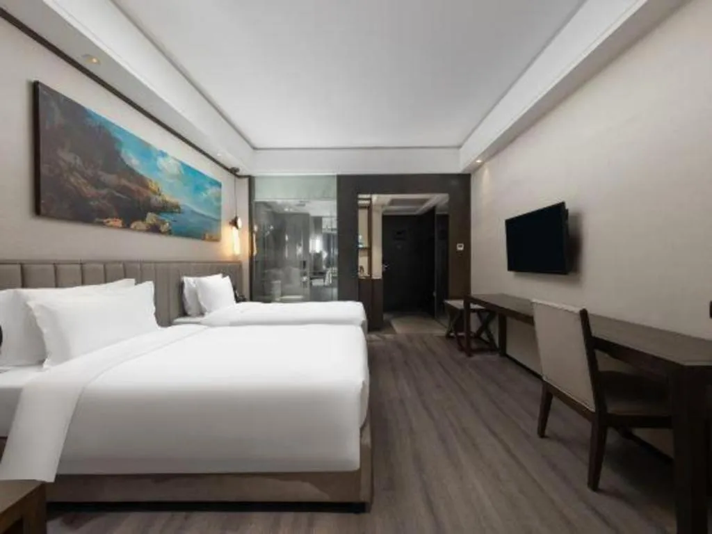 Bed in Zhuhai Starlight Hotel