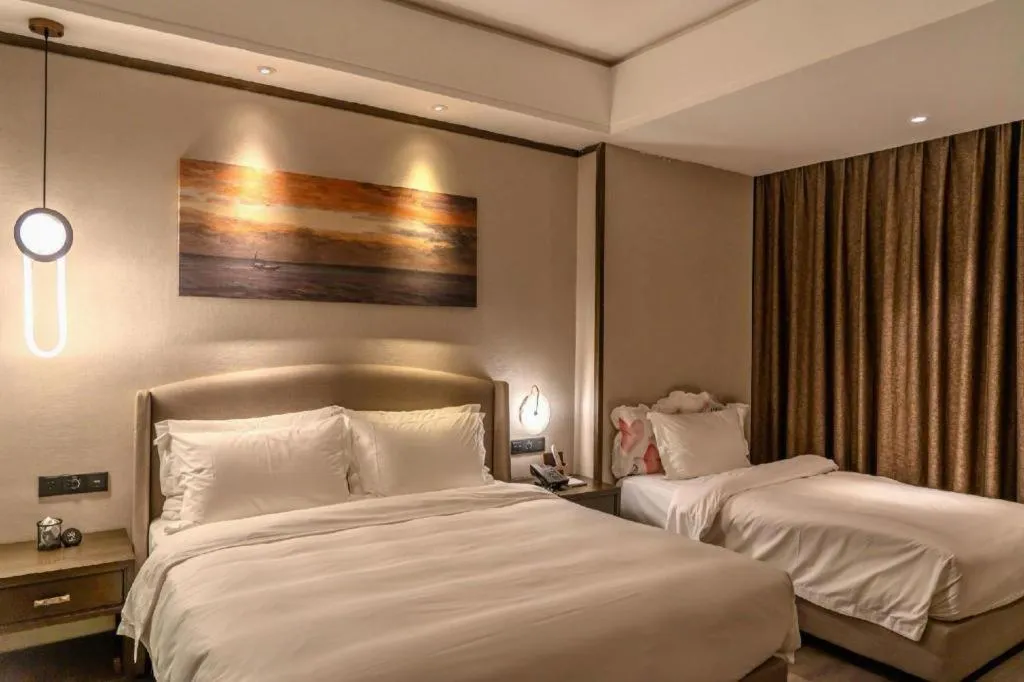Bed in Zhuhai Starlight Hotel