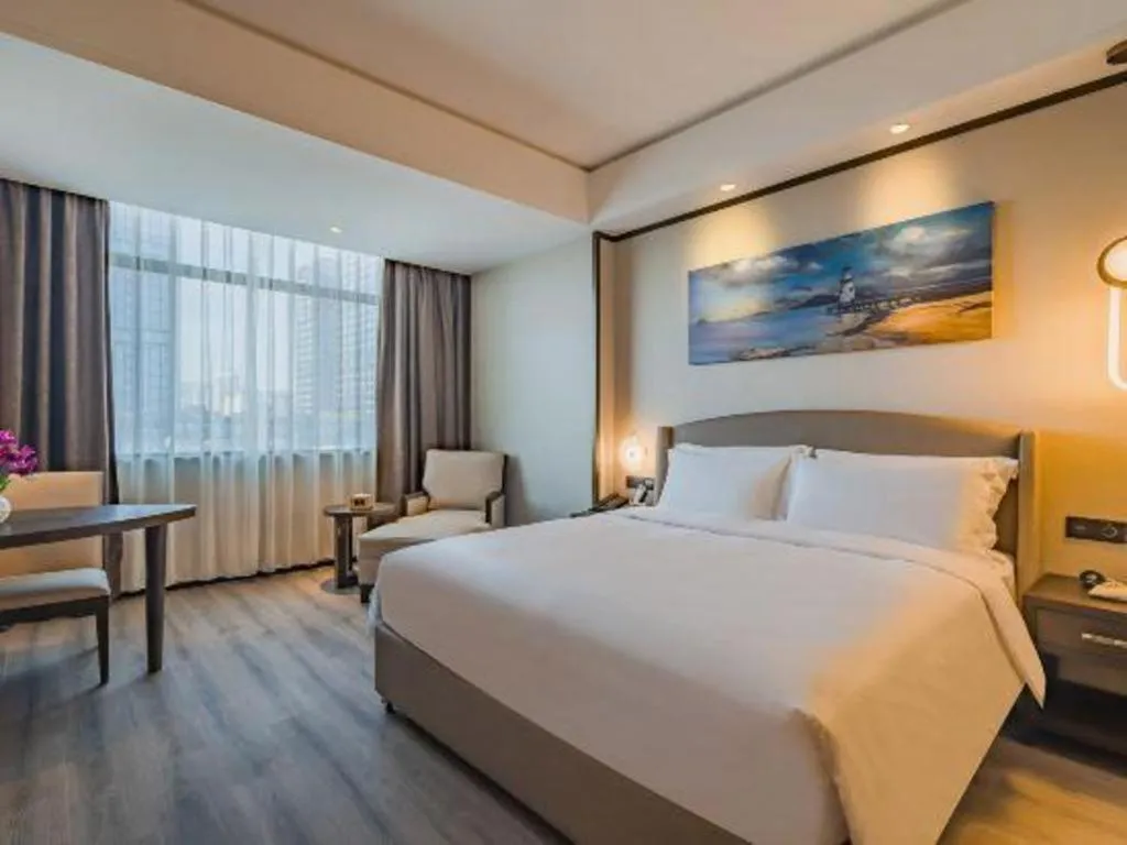 Bed in Zhuhai Starlight Hotel