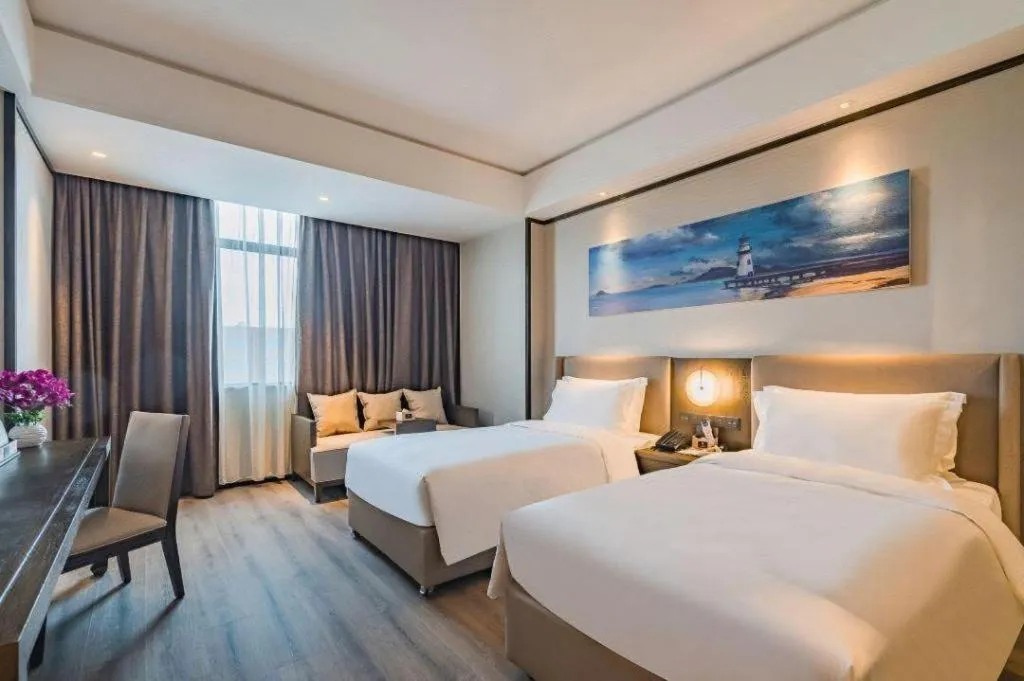 Bed in Zhuhai Starlight Hotel