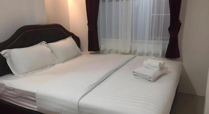Bed in Ban Thungdang Housetel Bangkok
