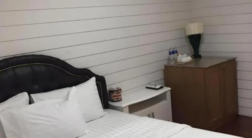 Bed in Ban Thungdang Housetel Bangkok