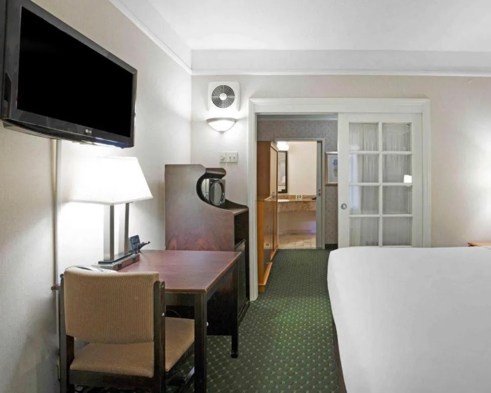 Bed in Ramada Suites by Wyndham San Diego