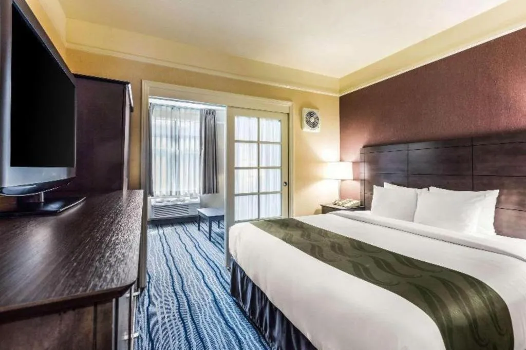 Bed in Ramada Suites by Wyndham San Diego