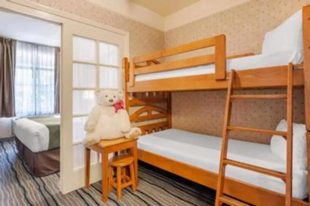 Bed in Ramada Suites by Wyndham San Diego