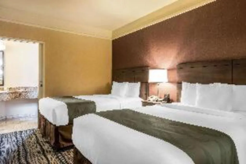 Bed in Ramada Suites by Wyndham San Diego