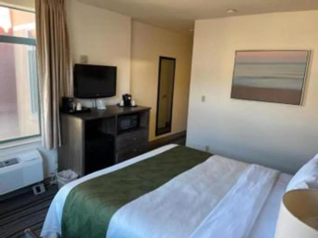 Bed in Ramada Suites by Wyndham San Diego