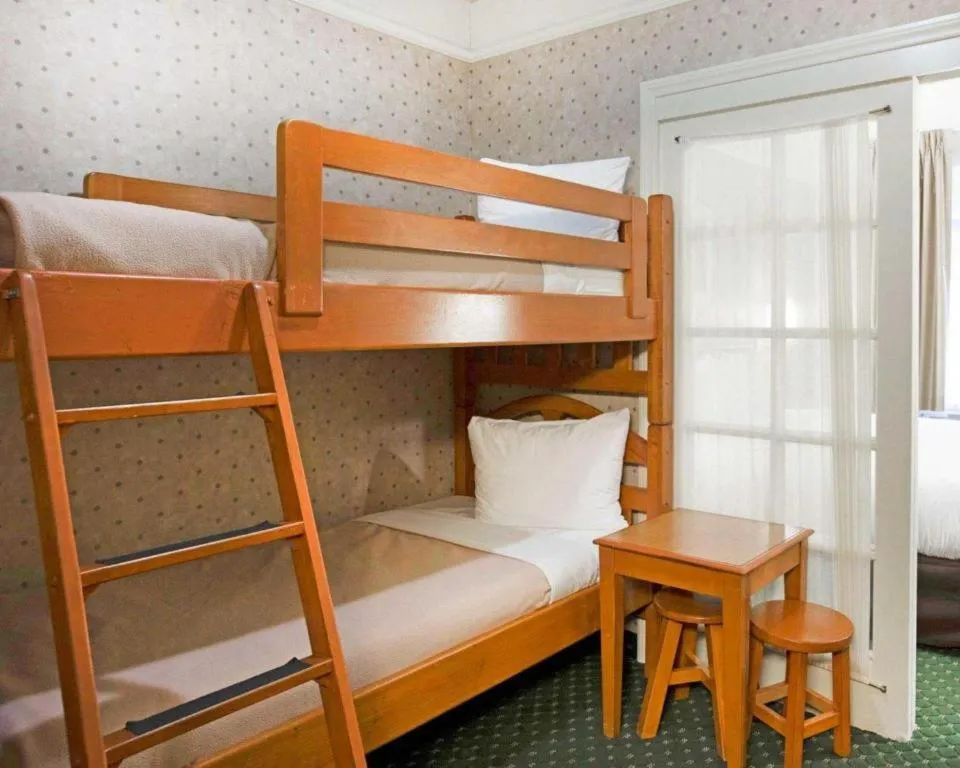 Bed in Ramada Suites by Wyndham San Diego