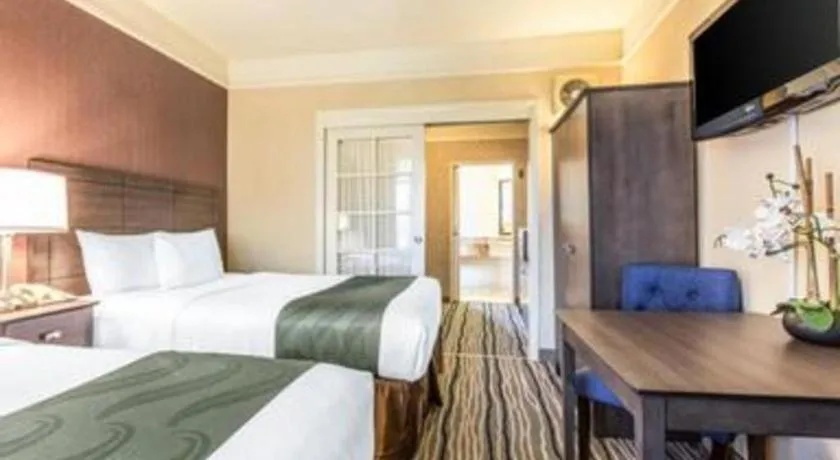 Bed in Ramada Suites by Wyndham San Diego