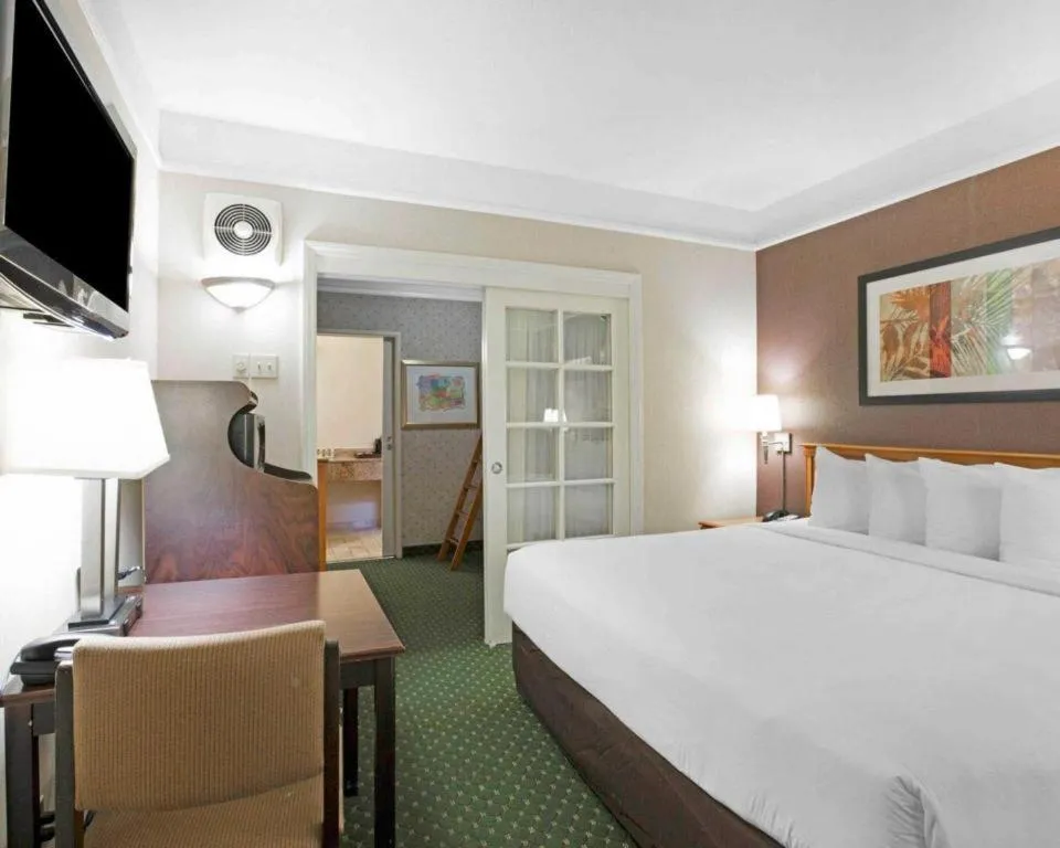 Bed in Ramada Suites by Wyndham San Diego